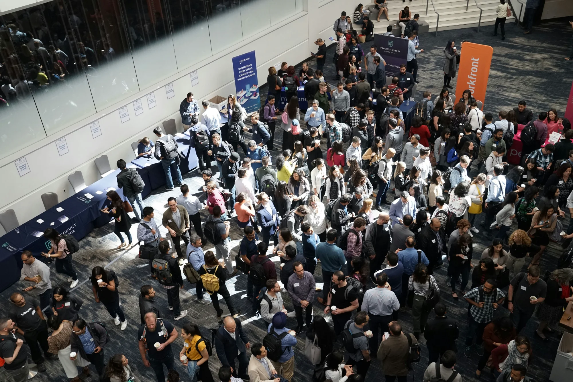 Attendees networking in a corporate conference hall